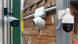 High-definition white bullet CCTV camera mounted securely on a textured red brick wall.