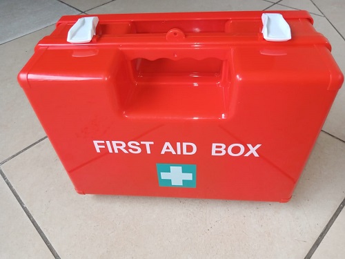 Fully stocked red first aid kit and emergency medical response box in Kenya